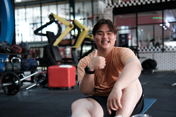 Happy Overweight Man Smiling After Workout at Gym