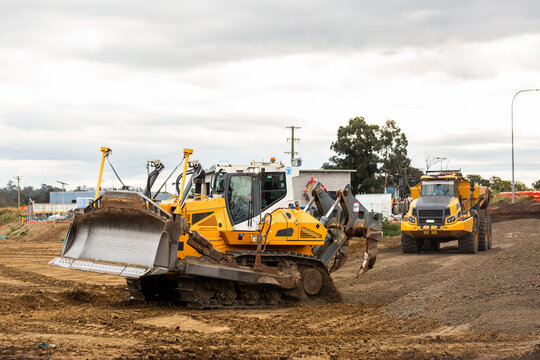 bulldozer and dump truck on construction site with earthworks building Singleton bypass