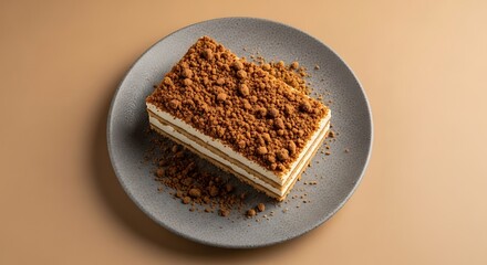 Close up of a layered cake with a crunchy topping.