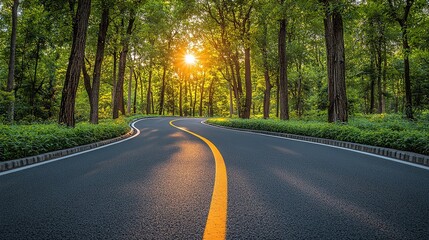 Fototapeta premium Winding road through lush forest with sunlight filtering through trees. Ideal for nature, travel, serene