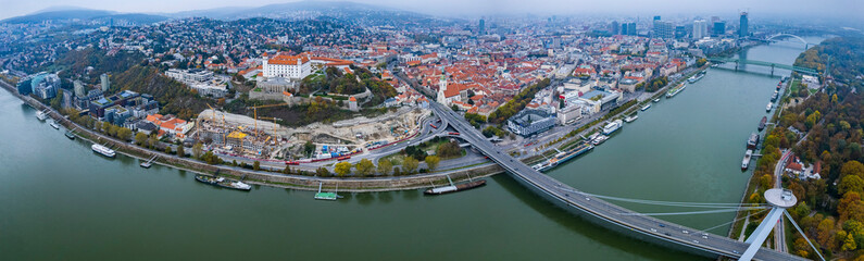 Fototapeta premium Aerial view around the city capitol Bratislava in Slovakia on a cloudy autumn day.