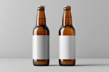 Two amber glass beer bottles, blank white labels, studio shot
