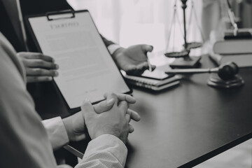 Lawyer explained to the client about the law that must be brought against the court case.