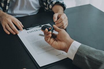 Car salesman gave the keys to the customers who signed the purchase contract legally, Successful...
