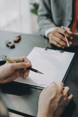 Car salesman gave the keys to the customers who signed the purchase contract legally, Successful...