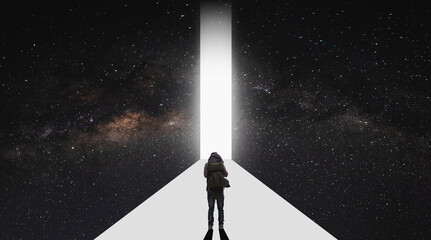 a man standing on white path, achieving and aiming to bright light entrance. Goal, achievement and ambition concepts