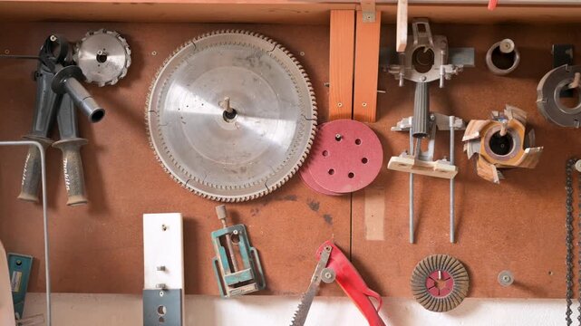 A set of carpentry tools arranged on a pegboard in a workshop, ready for a DIY project. High quality 4k footage