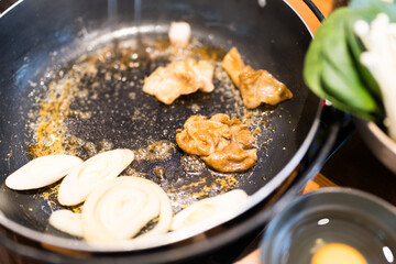 Japanese traditional cuisine, cooking Sukiyaki, stir fried vegetables with meat