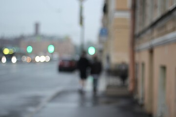 Urban life city photo unfocused lights road people buildings 