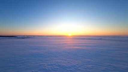 Winter Sunset over a Vast Snow-Covered Plain - Powered by Adobe