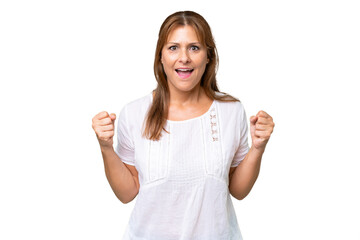 Middle-aged caucasian woman over isolated background celebrating a victory in winner position