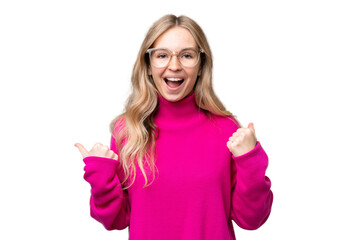 Young English woman over isolated background celebrating a victory in winner position