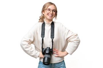 Young photographer English woman over isolated background posing with arms at hip and smiling
