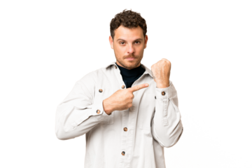 Brazilian man over isolated chroma key background making the gesture of being late