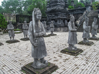 Obraz premium Hue, Vietnam. Row of statues at Minh Mang Tomb, Hue, Vietnam. Stone statues of the army in the mausoleum of Vietnam emperor ancient cultural heritage of Vietnam in province Hue