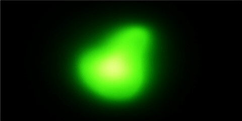 Green glowing neon sign with bright light on dark background