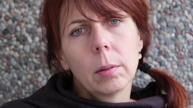 face of angry woman dissatisfied with life and everything that happens. man is grimacing