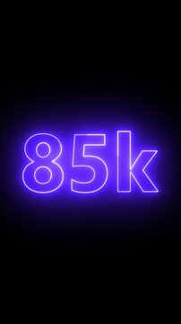 Glowing red neon 85K light text animation. Shining neon number motion graphic for 85K followers and subscribers celebration. Social media milestone achievement neon effect video on black background.