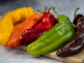 red hot chili peppers on wooden background