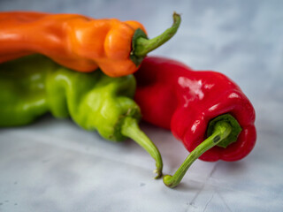 red and yellow peppers on white background