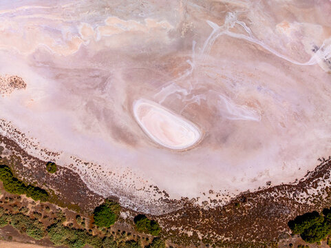 Aerial view of detail and patterns in a colourful salt lake