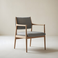 This is a front-facing shot of the same armchair, viewed directly from the front. The chair has a light-colored wooden frame with light gray upholstered cushions on the seat and backrest. The backgrou