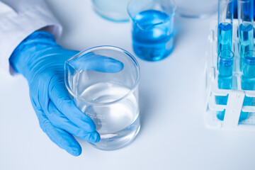 Professional scientist working writing experiment research results on tablet document for data analysis chemist hospital new discovery in genetic future planning innovation biotechnology chemical