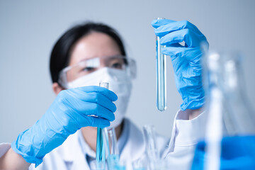 Woman scientist technician working on laboratory research in hospital for science pharmaceutical...