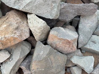 Raw stone pile textures, various sizes of natural rock formations, gray surface minerals, rough texture solid blocks, geological materials, stone pile for building foundations and walls