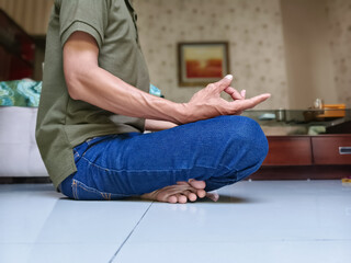 Quiet contemplation: a man finds serenity in the art of meditation, fostering inner peace and...