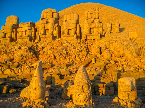 Giant statues antique stone heads on Nemrut Dag in Turkey. Nemrut Dag archeological site high mountain in Adiyaman, summit with large statues in a royal tomb from ancient times. East Turkey sights