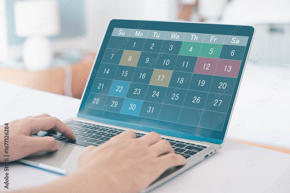 Poster digital calendar on laptop screen with highlighted dates, symbolizing schedule planning, time manage