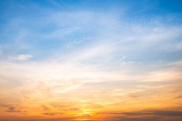 Fototapeta premium Beautiful , luxury soft gradient orange gold clouds and sunlight on the blue sky perfect for the background, take in evening,Twilight, Large size, high definition landscape photo