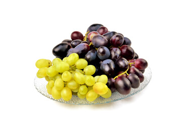 yellow and blue grapes on white plate