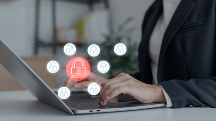 Businesswoman using laptop with red unlocked padlock and hacker icon, cybersecurity data breach, hacking, online fraud, and digital security threat concept.