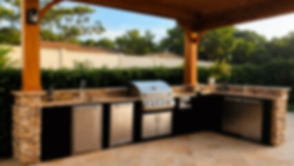 Fototapeta premium Blurred image of outdoor kitchen interior with open nature theme, kitchen equipment visible, Evergreen, blurry wallpaper.