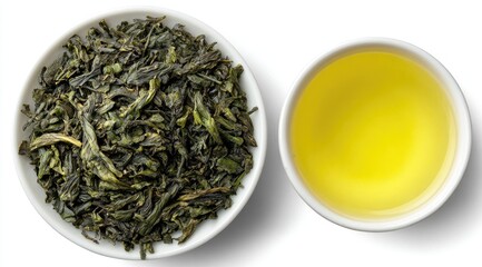 Fototapeta premium Overhead view of loose leaf green tea and brewed tea in small white bowls