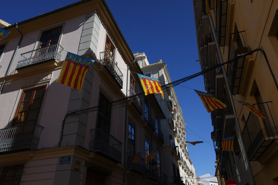 Fototapeta Valencia flag in the sun on the streets of Valencia.
