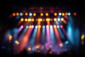 Blurry stage lights and beams.  Multi-colored spotlights create a vibrant, out-of-focus stage