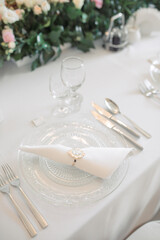 Elegant dining table setting with floral decor