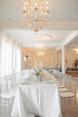 Elegant wedding dining setup in bright venue