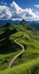 Winding mountain road through lush green hills under a vibrant sky