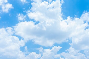 Bright blue sky with fluffy white cumulus clouds A scenic daytime view