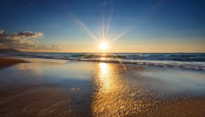 Fototapeta premium sun rays create glistening reflections on beach water