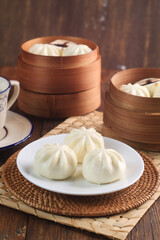 Bakpao Coklat, chinese steamed buns with chocolate paste on bamboo basket
