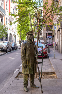 Madrid, Madrid, Spain - April 10, 2024: Bronze statue by the artist Felix Hernando, that recalls the old lamplighters of Madrid