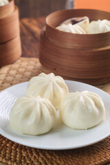 three pao on white plate 