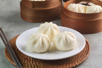 three pao on white plate 