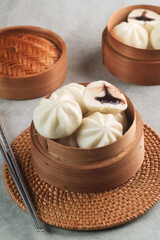 Bakpao Coklat, chinese steamed buns with chocolate paste on bamboo basket
