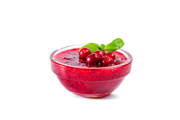 Lingonberry jam with lingonberries and leaves isolated on white background.